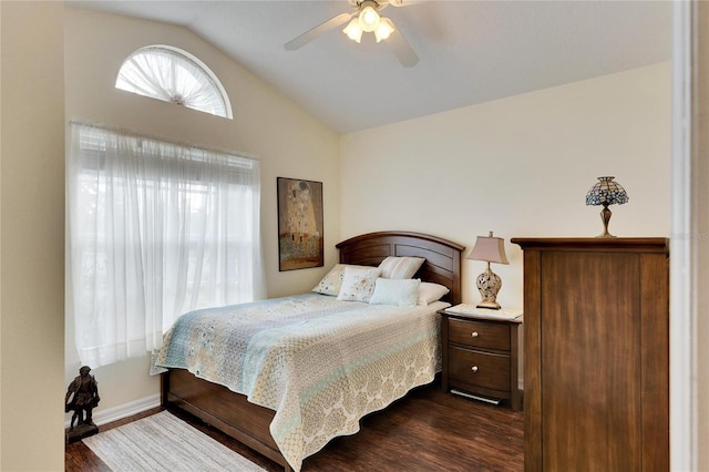 bedroom featuring vaulted ceiling, dark hardwood / wood-style floors, and ceiling fan