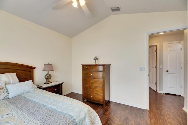 bedroom with ceiling fan, dark hardwood / wood-style floors, and vaulted ceiling