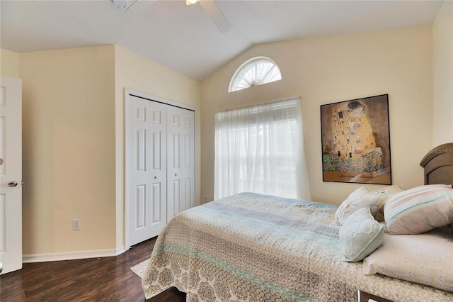 bedroom with lofted ceiling, dark wood-type flooring, a closet, and ceiling fan