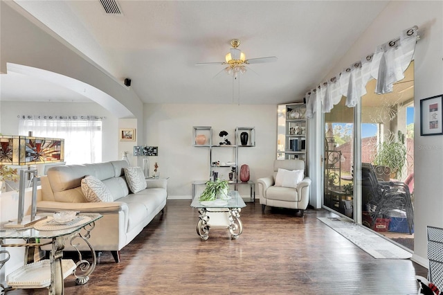 living room featuring ceiling fan, lofted ceiling, and dark hardwood / wood-style floors