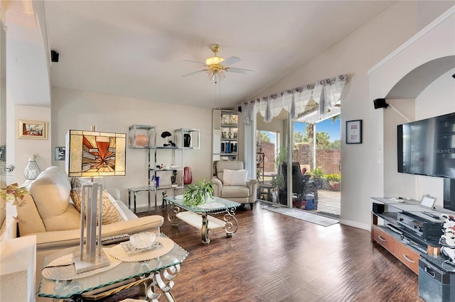 living room with ceiling fan, lofted ceiling, and dark hardwood / wood-style flooring