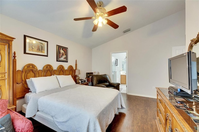 bedroom featuring connected bathroom, vaulted ceiling, dark hardwood / wood-style floors, and ceiling fan