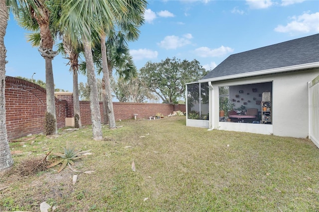 view of yard featuring a sunroom