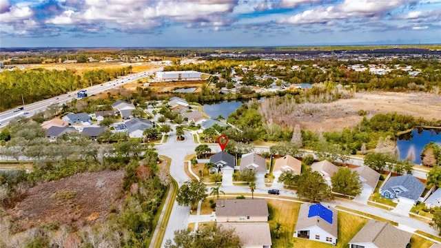 drone / aerial view featuring a water view