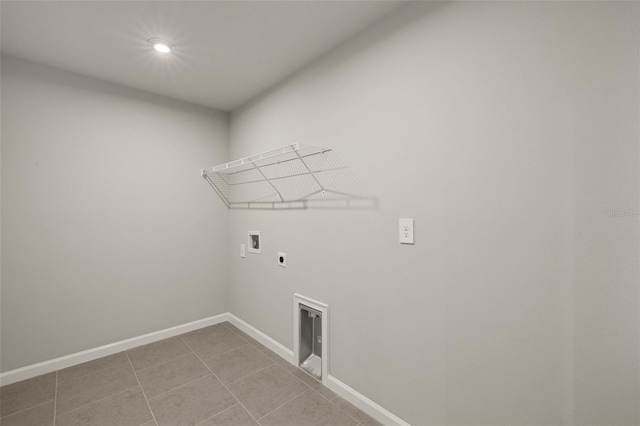 washroom featuring light tile patterned flooring, hookup for a washing machine, and electric dryer hookup