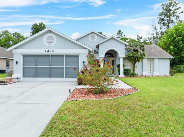 ranch-style home with a garage and a front lawn