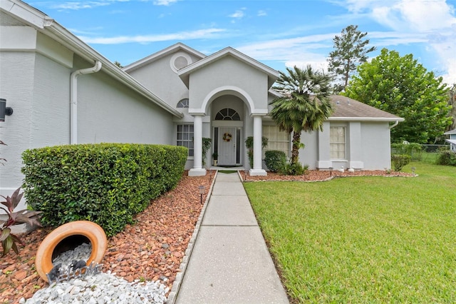 property entrance featuring a yard