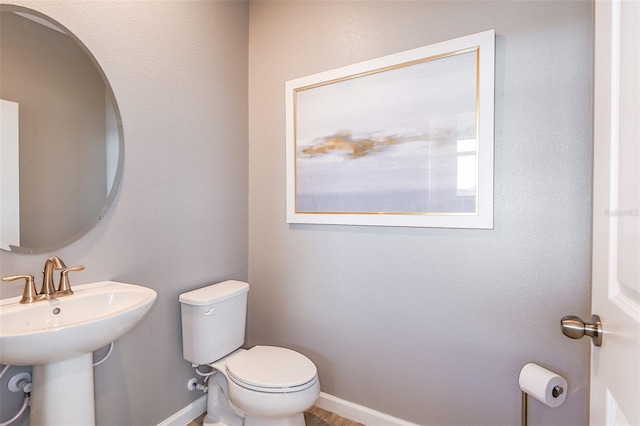 bathroom with toilet and sink