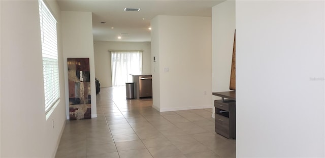 hallway with light tile patterned floors