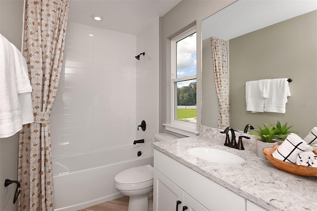 full bathroom with shower / bath combo with shower curtain, toilet, wood-type flooring, and vanity