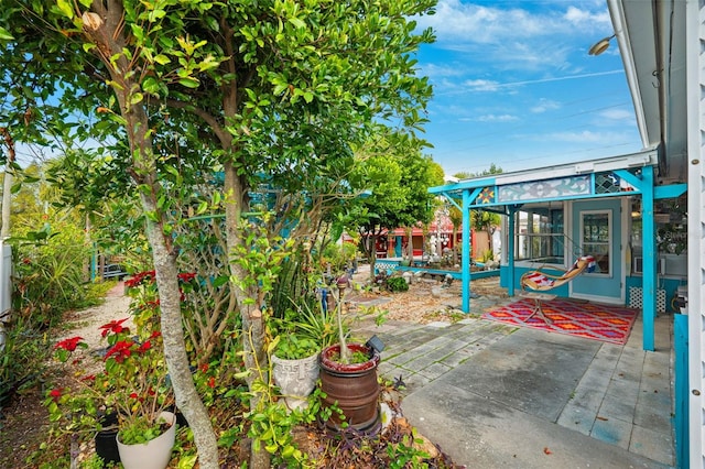 view of patio with a sunroom