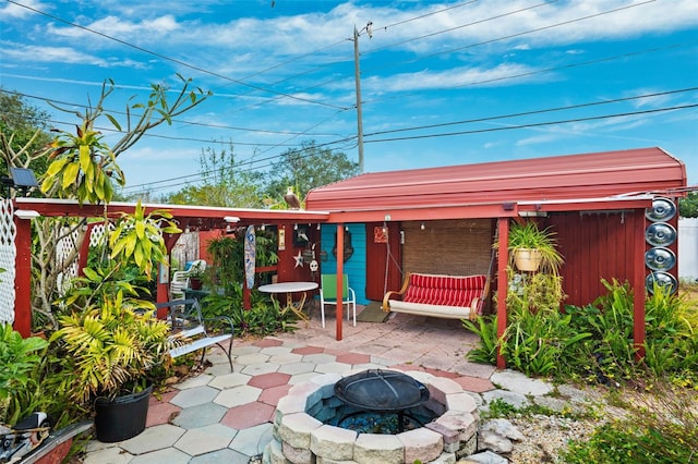 view of patio / terrace featuring a fire pit