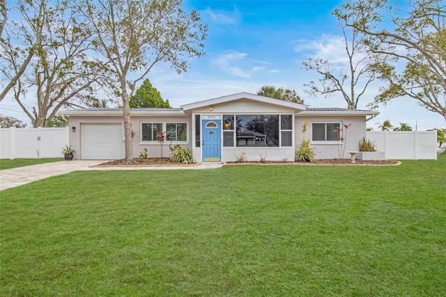 single story home featuring a garage and a front lawn