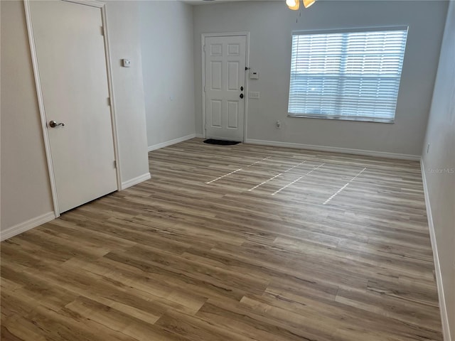 spare room featuring light hardwood / wood-style floors