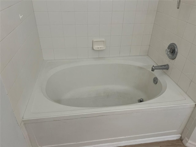 bathroom featuring hardwood / wood-style floors and a bathtub