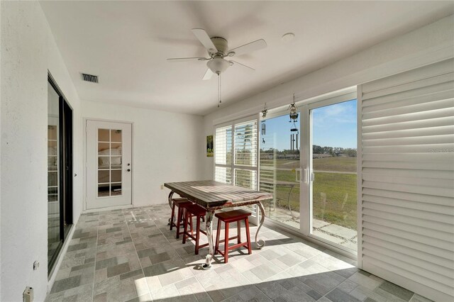 dining area with ceiling fan