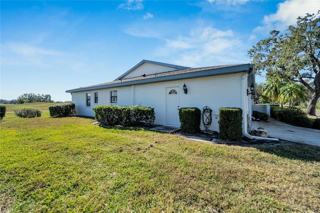 view of home's exterior featuring a lawn