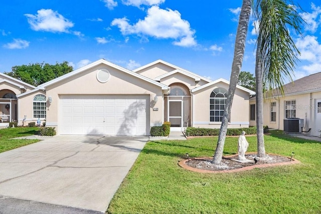 single story home with central AC, a garage, and a front lawn