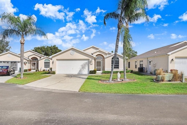 single story home featuring a front lawn, central AC unit, and a garage