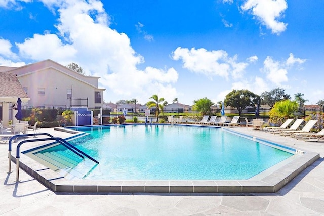 view of swimming pool with a patio area