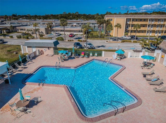 view of swimming pool with a patio area