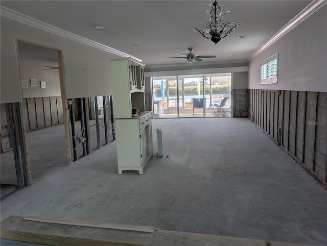 interior space featuring plenty of natural light, ceiling fan, and ornamental molding