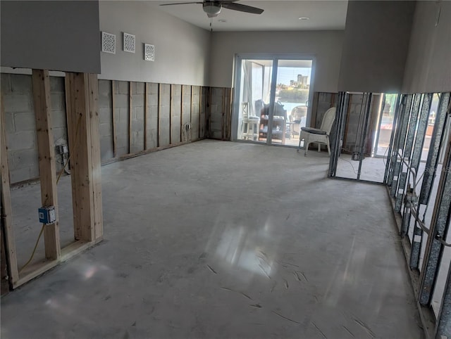 spare room with concrete floors and ceiling fan