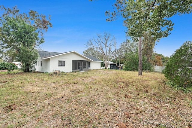 view of yard featuring a sunroom