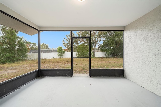 unfurnished sunroom featuring plenty of natural light