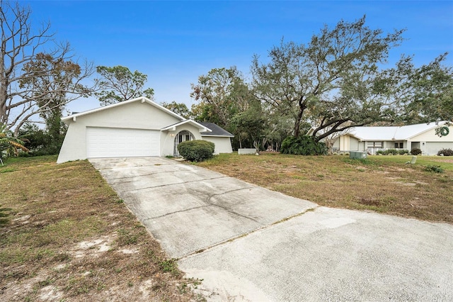 single story home with a front lawn and a garage