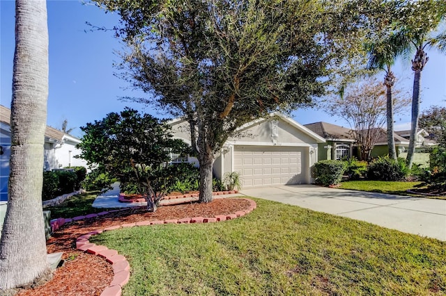 single story home with a garage and a front lawn