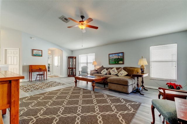 living room featuring light hardwood / wood-style floors, ceiling fan, and lofted ceiling