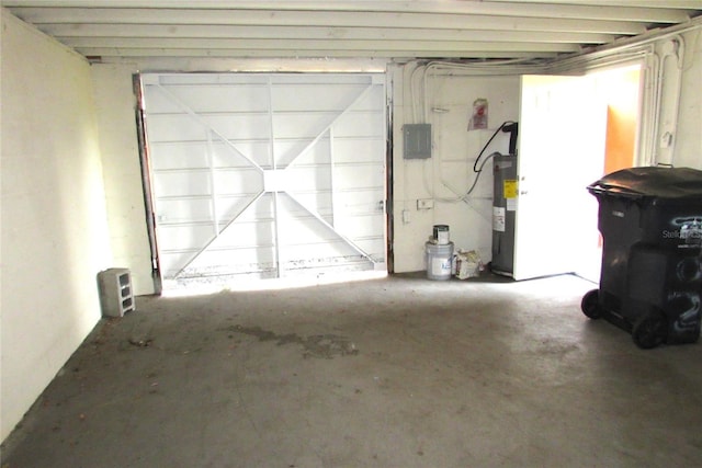 garage with electric panel and electric water heater