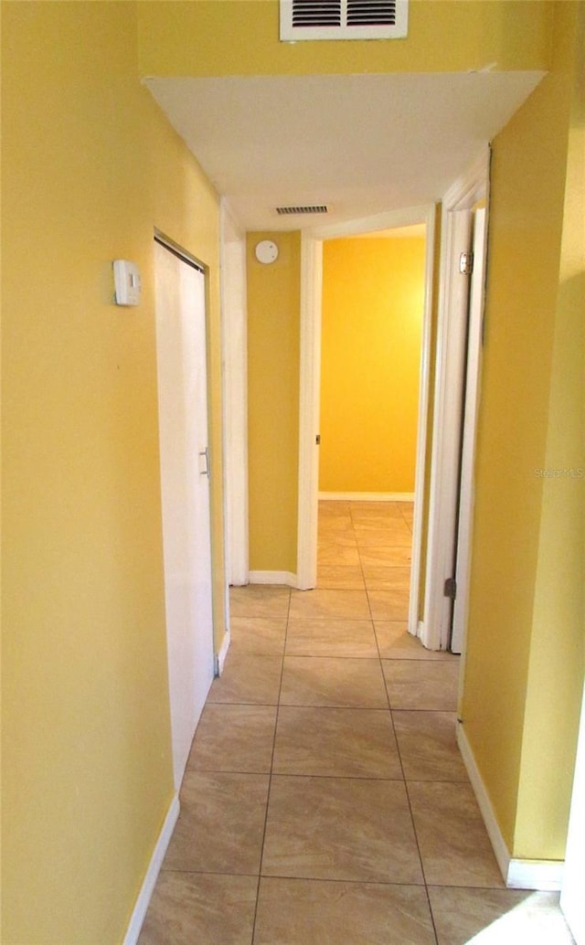 hallway featuring tile patterned floors