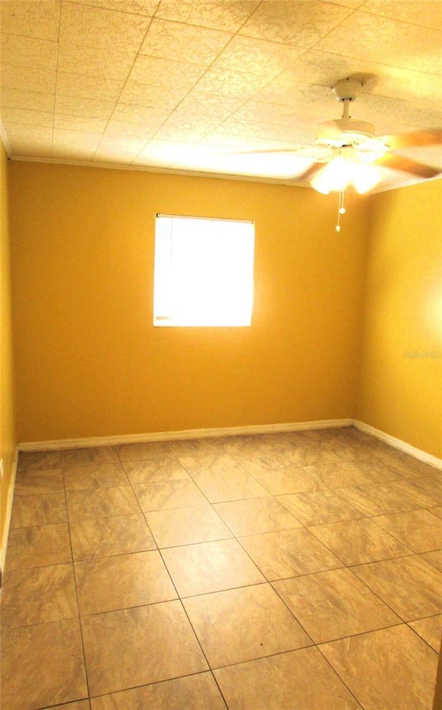 spare room featuring ceiling fan