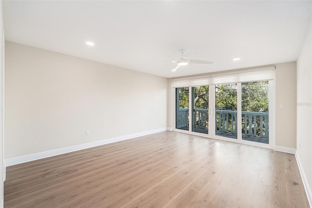 unfurnished room with ceiling fan and light hardwood / wood-style flooring