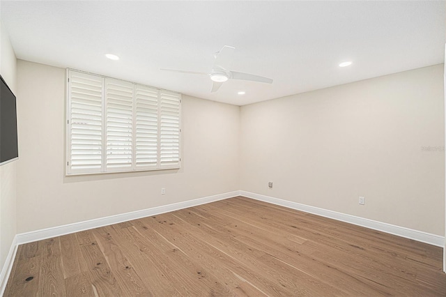 unfurnished room with hardwood / wood-style floors and ceiling fan