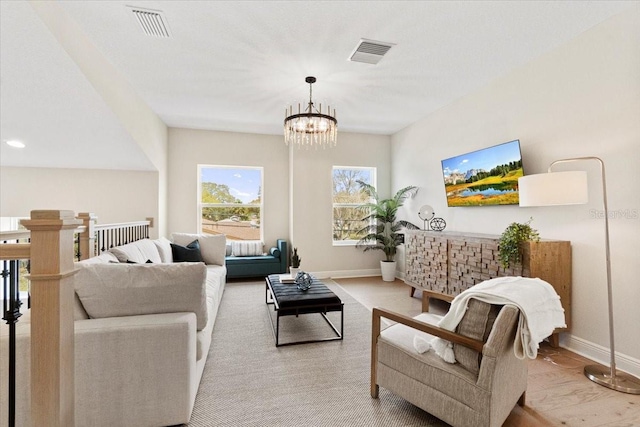 living room with an inviting chandelier