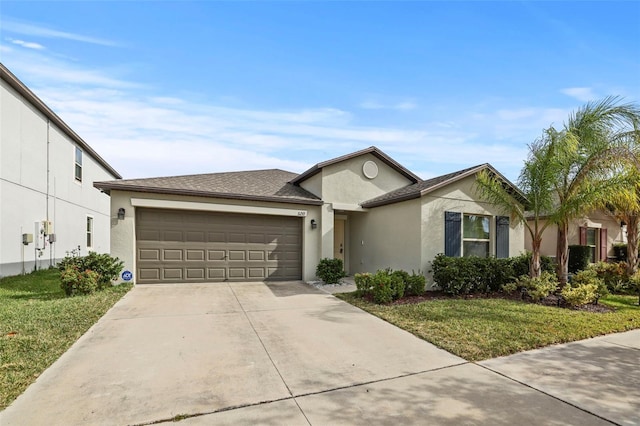 ranch-style house with a garage and a front lawn