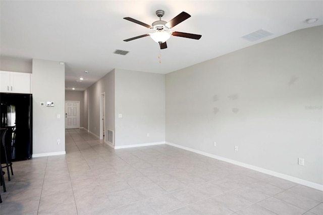 unfurnished living room featuring ceiling fan and light tile patterned flooring