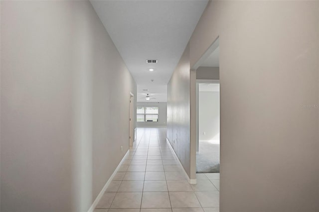 hallway with light tile patterned floors