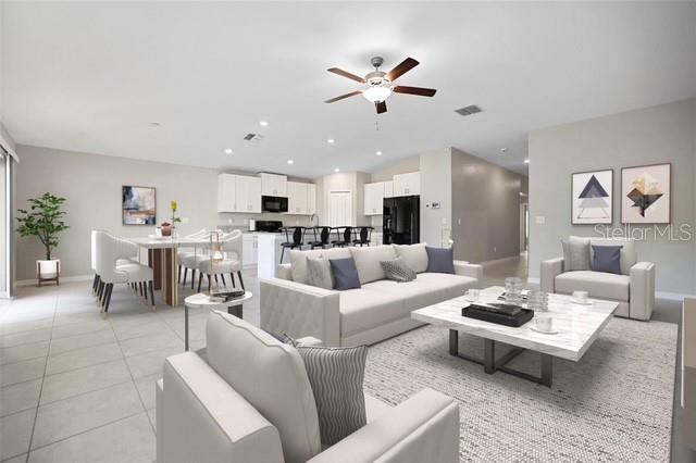 living room featuring light tile patterned floors, recessed lighting, vaulted ceiling, ceiling fan, and baseboards