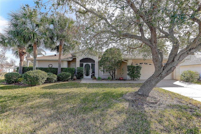 view of front of house with a garage and a front lawn