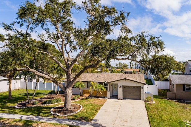 view of front of property featuring a garage and a front lawn