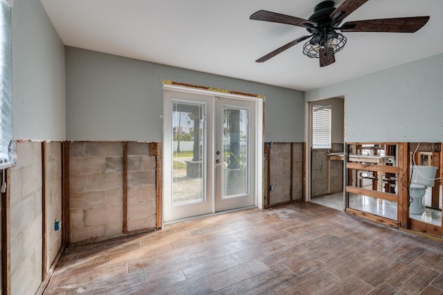 interior space featuring ceiling fan and french doors