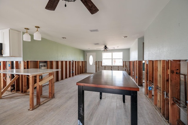 recreation room with ceiling fan and light hardwood / wood-style flooring