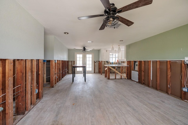 interior space with french doors, light hardwood / wood-style flooring, and ceiling fan