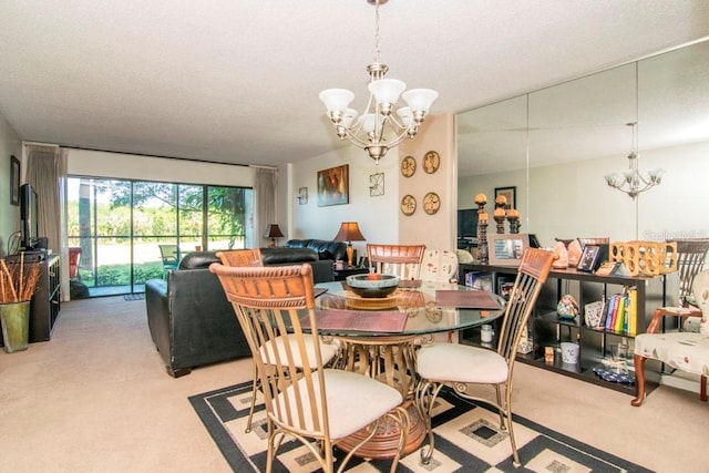 dining room with a chandelier and light colored carpet