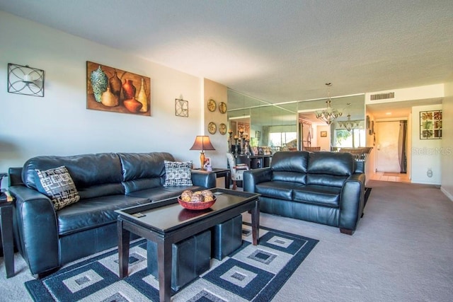 living room featuring carpet flooring and a notable chandelier