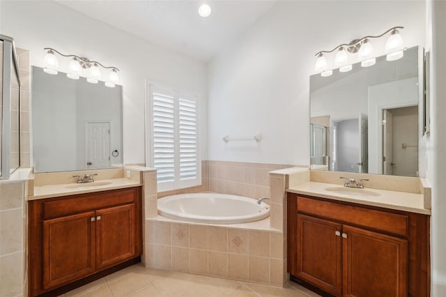 bathroom with tile patterned flooring, vanity, and independent shower and bath